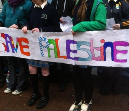 All around cheery kids hoisted 'Save Palestine' placards